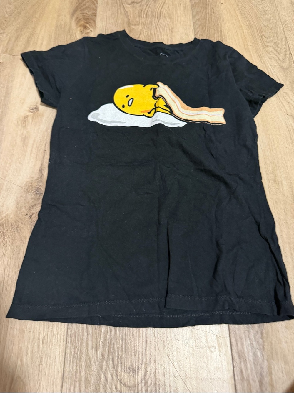 Black Graphic Tee with Yellow Gudetama and Brown Bacon Print